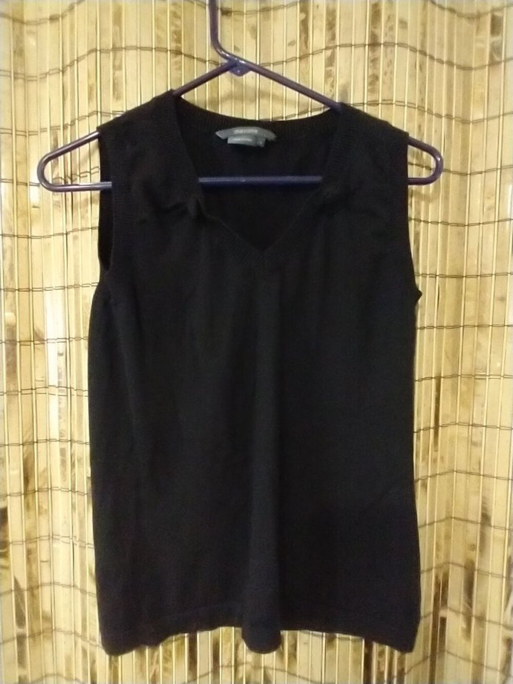 Maxime black sleeveless V-neck sweater vest in a size Medium